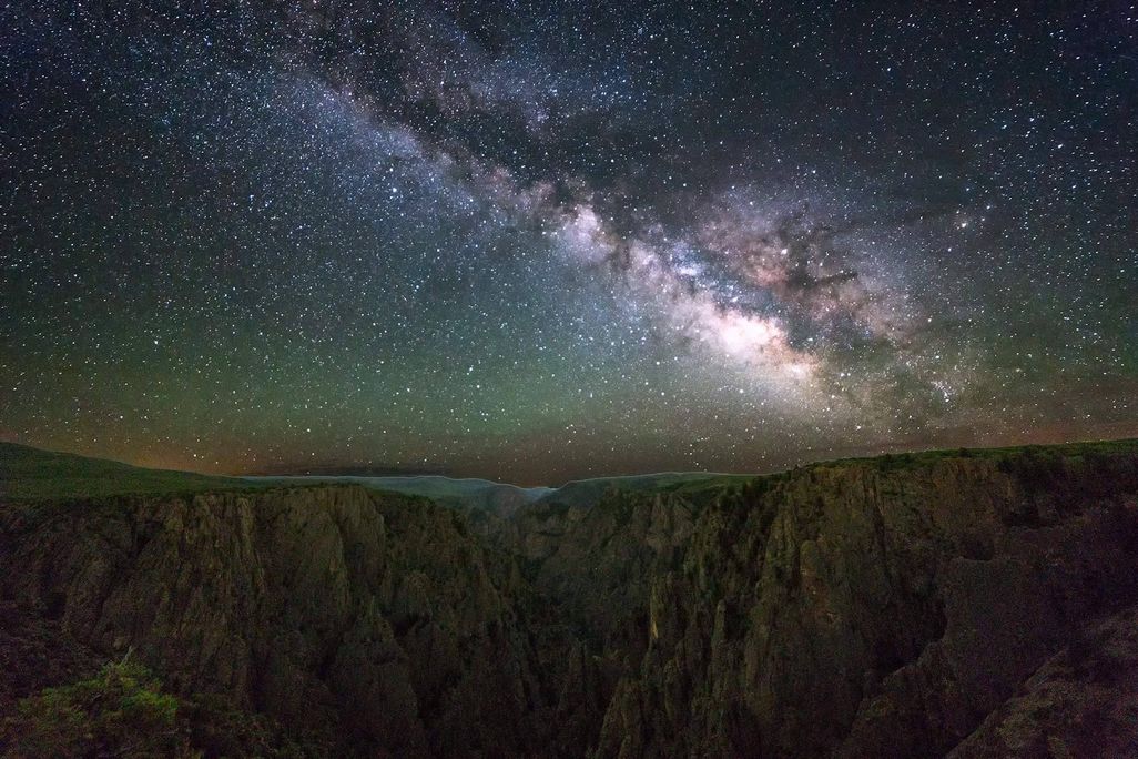 Milky Way over a dark landscape