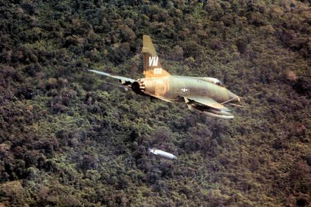 A North American F-100D Super Sabre drops a napalm bomb near Bien Hoa, South Vietnam, 1967.