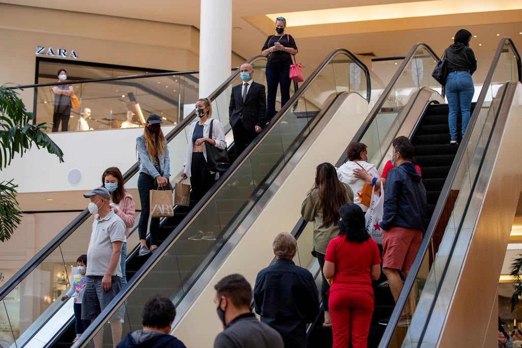 Shoppers continue to wear masks inside South Coast Plaza on May 13, 2021 in Costa Mesa, California.