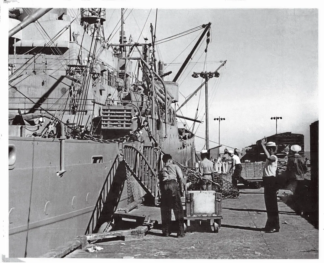 a shipping dock with men loading cargo