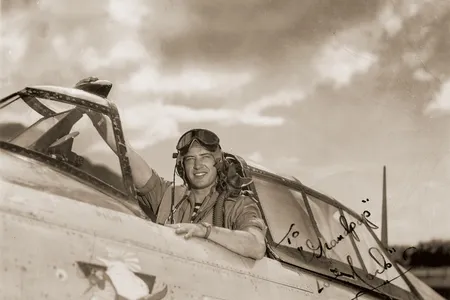 Lieutenant John Payne mailed this publicity photo of himself posing in the cockpit of a Republic P-47D home to his grandfather.