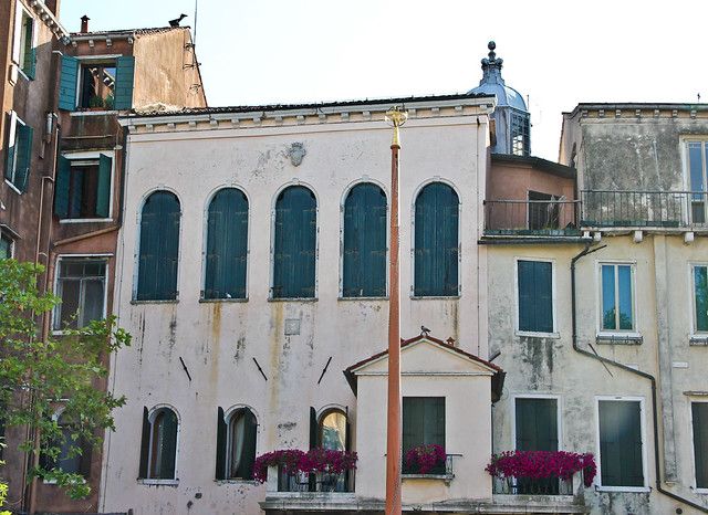 Italian Synagogue in the Venetian ghetto pictured with five large windows at top