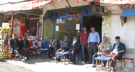 They may look friendly, but be warned: These village men will smother travelers with kindliness and drown them in tea.