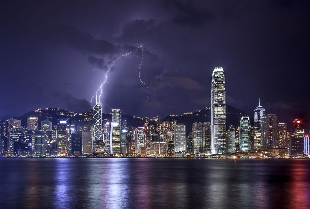 Solitary lightning strike over the Hong Kong Island/Victoria Harbor ...