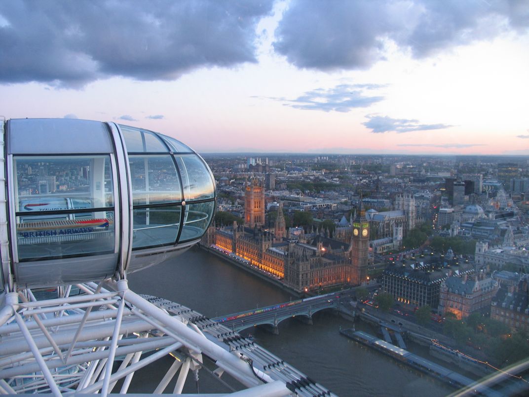 A capsule of the London Eye, high above Parliament