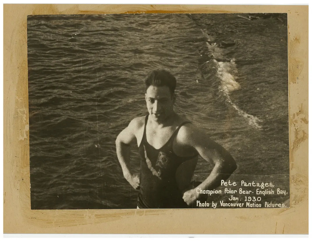 a man stands in the water with his hands on his hips