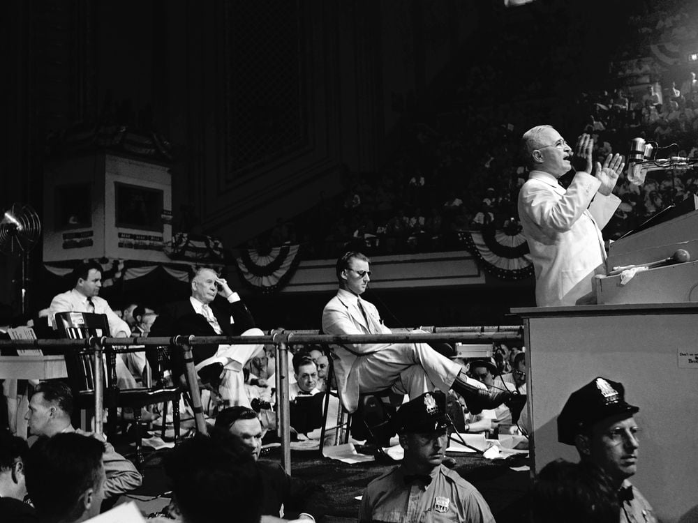 President Harry S. Truman speaks from the dais at the Convention Hall as Senator Alben W. Barkley looks on during the 1948 Democratic National Convention in Philadelphia, Pennsylvania
