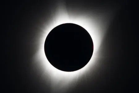 Black circle with a ring of light around it