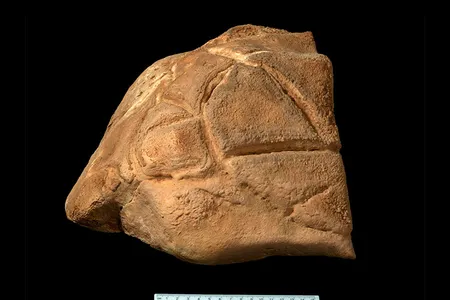 The carved boulder, which weighs about 60 pounds and measures less than a foot across, &ldquo;may have represented a totem or a mythological or spiritual figure,&rdquo; says archaeologist Omry Barzilai.