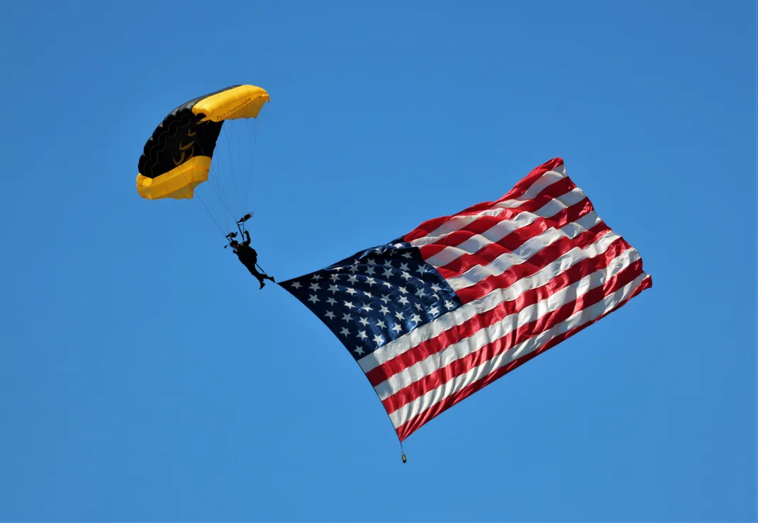 12 - A member of the U.S. Army Golden Knights Parachute Team sails in to help open the Sun ’N’ Fun Aerospace Expo in Lakeland, Florida.