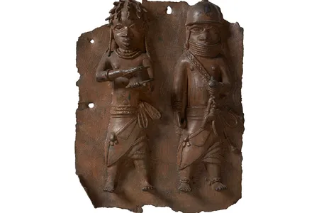 A plaque depicting a war chief and a royal military priest carrying a leather gift box