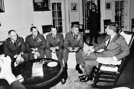 President Kennedy meets with Gen. Curtis LeMay and the pilots who discovered the Cuban missiles.