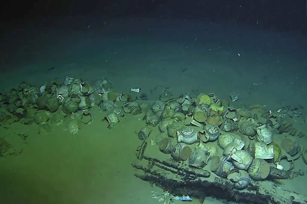 Underwater shipwreck jugs and plates
