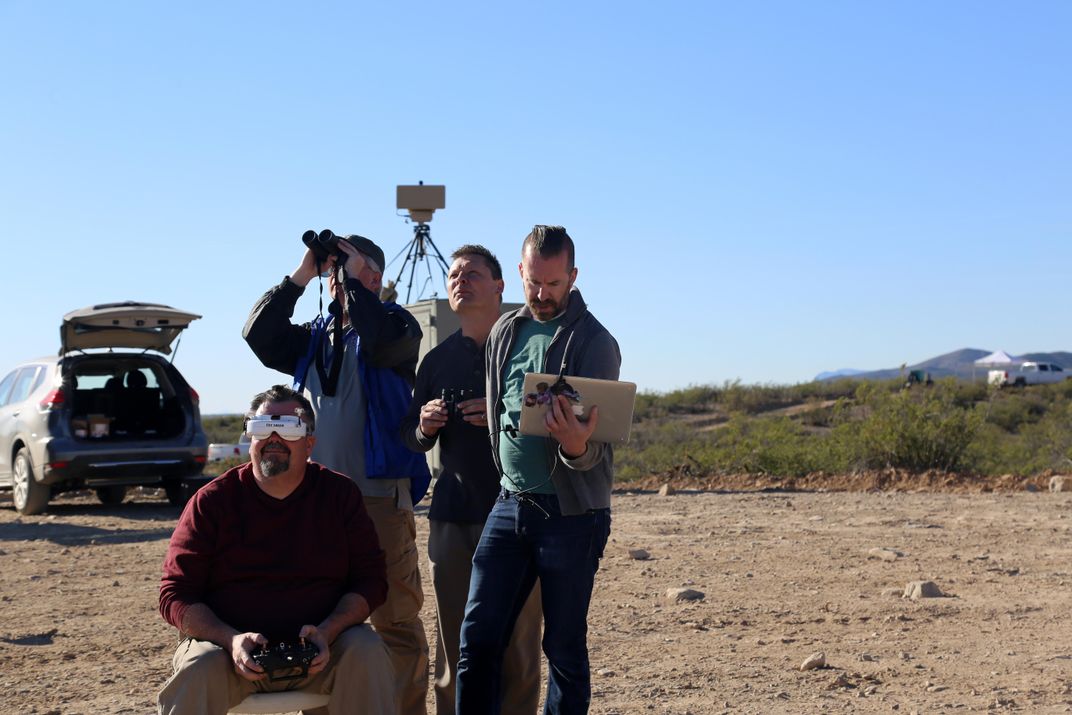 a counter-drone team watches their system in action