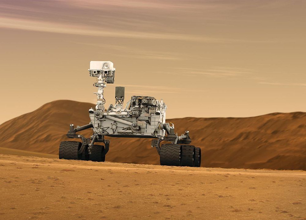 1280px-Mars_Rover_Curiosity_in_Artist's_Concept,_Wide.jpg