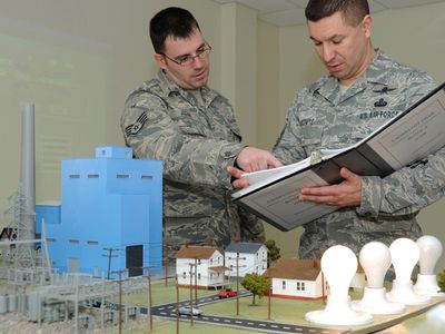 U.S. Air Force Staff Sgt. Christopher Judge, left, and Master Sgt. Manuel Matute conduct a final check on industrial control systems (ICS) equipment to verify results of their first ICS exercise during the enlisted portion of undergraduate cyberspace defense operations training at Keesler Air Force Base, Miss., Jan. 24, 2011. The 333rd Training Squadron is responsible for providing the initial skills for the new Air Force Specialty Code, 1B4X1, cyber defense operations. Judge is a cyberspace defense operations instructor; Matute is a cyberspace defense operations instructor supervisor. (U.S. Air Force photo by Kemberly Groue/Released)