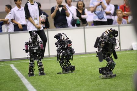 Robots in the "kid-size" (really around 16 inches tall) Robocup soccer league face off. These "Rhoban" bots, built by students at the University of Bordeaux, took first place in their division in the 2017 competition.