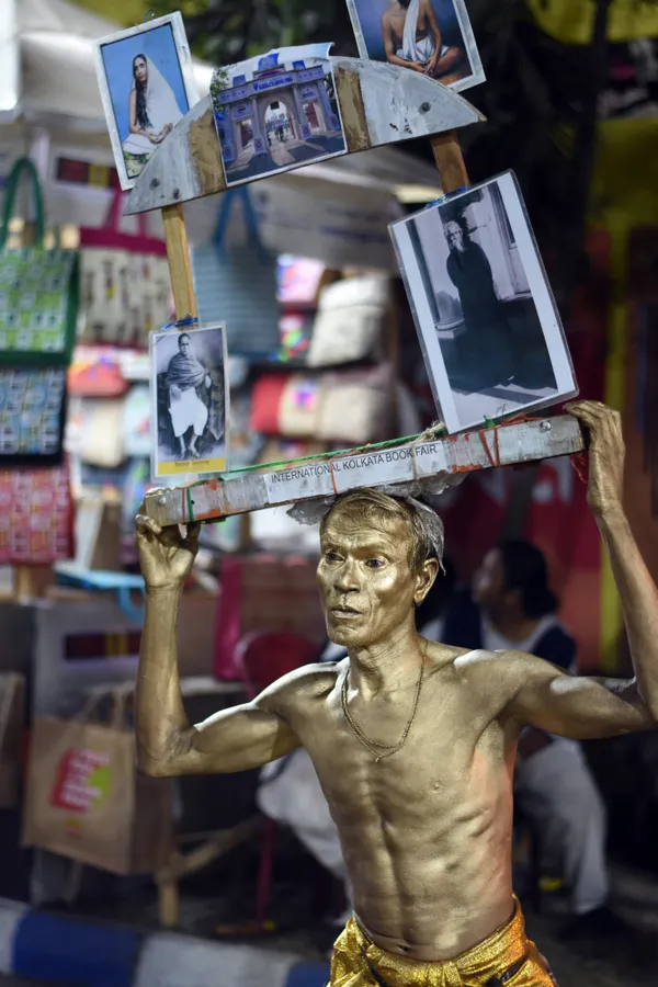 A man posing still like a statue thumbnail