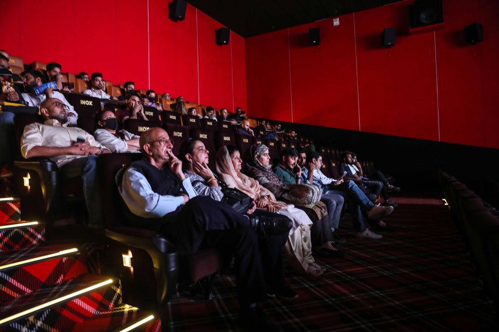 Members of the media and other guests watch the first show of a Bollywood movie Vikram Vedha inside Kashmirs first-ever multiplex 'INOX' on September 30, 2022 in Srinagar, India