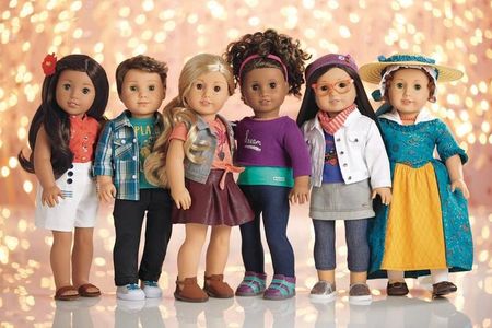 Logan (second from right) is the first ever boy American Girl doll.