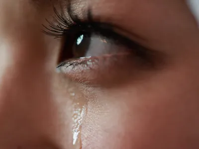 Human tears may contain an odorless chemical substance that reduces aggression, a new study finds.
