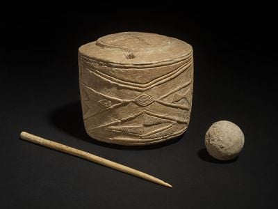 Archaeologists found a 5,000-year-old drum, a clay ball and a polished bone pin at a children&#39;s burial in the English village of Burton Agnes.&nbsp;