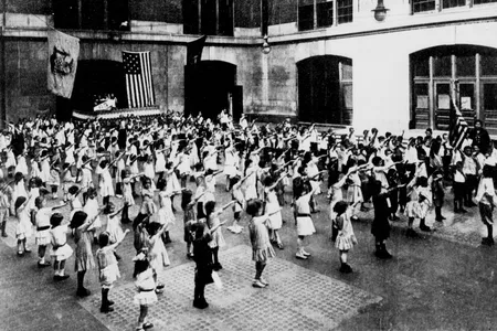 Children salute the American flag in 1915. 