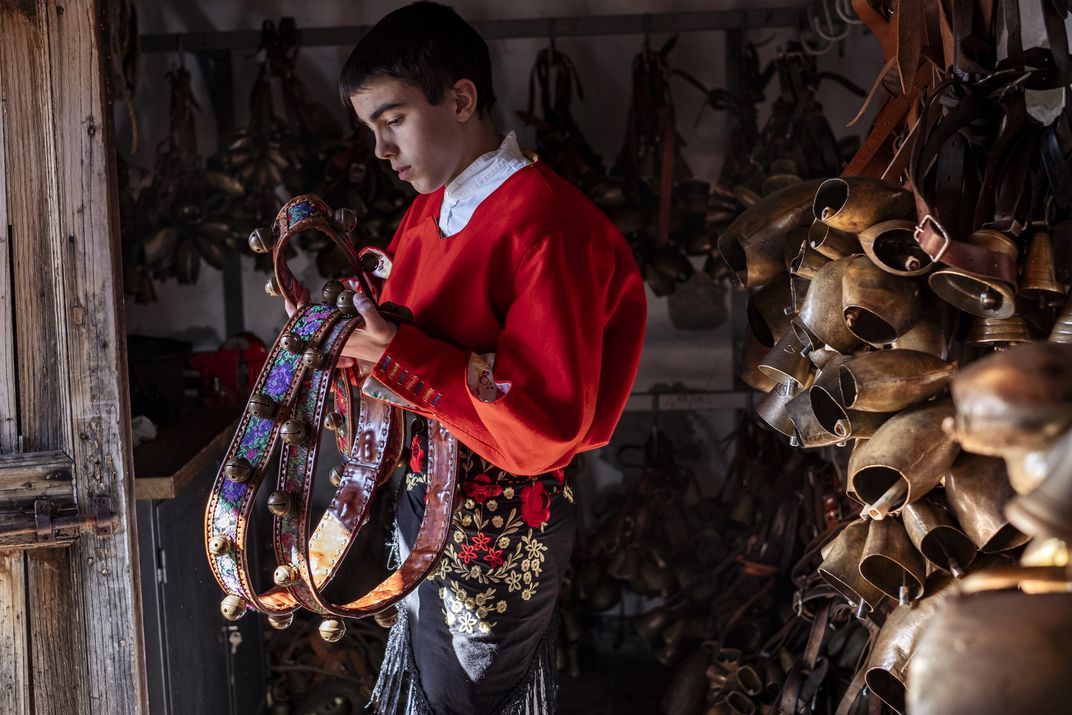 Issohadore Gianmario Muggittu holds an ornate belt with small bells, which he will sling across his body during the parade.