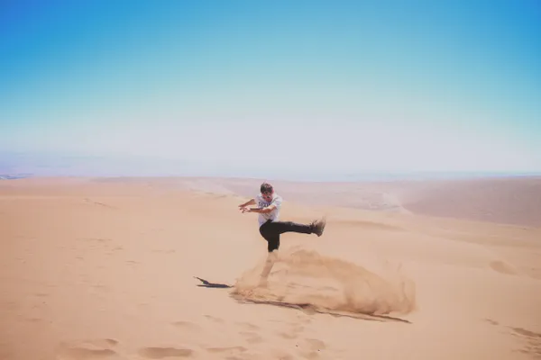 Man Kicking Sand in the Atacama Desert thumbnail