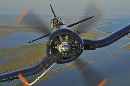 ★ Vought FG-1D Corsair ★ Another fighter powered by the Pratt & Whitney R-2800, the Corsair was intended for the Navy, but the initial designs provided pilot visibility too poor for carrier landings. Early production runs were given to the Marines, therefore, who turned them into legend. When the cockpit hood was redesigned, the Navy needed so many Corsairs that Vought opened production lines with Brewster and Goodyear—the former producing the FG-1 series, which flew in the May 2014 flyover. Above is an F4U-5N.