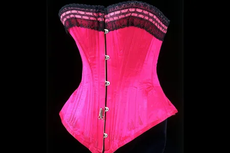 This silk satin, lace and whalebone corset gave an 1890s lady her hourglass figure and tiny waist. 