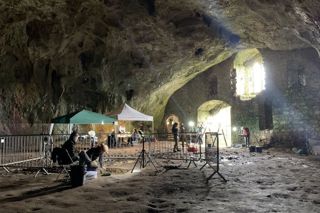 Archaeologists working in a cave