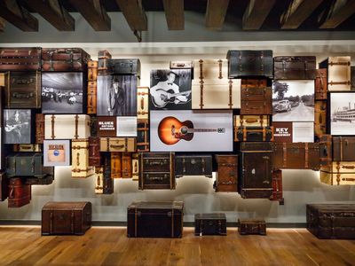 A wall of suitcases and photos inside the National Blues Museum.