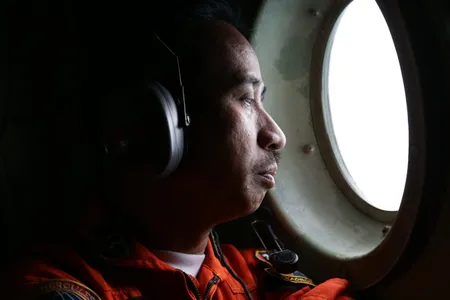 An Indonesian Air Force troops looks for AirAsia flight QZ8501 in the Karimata Strait.