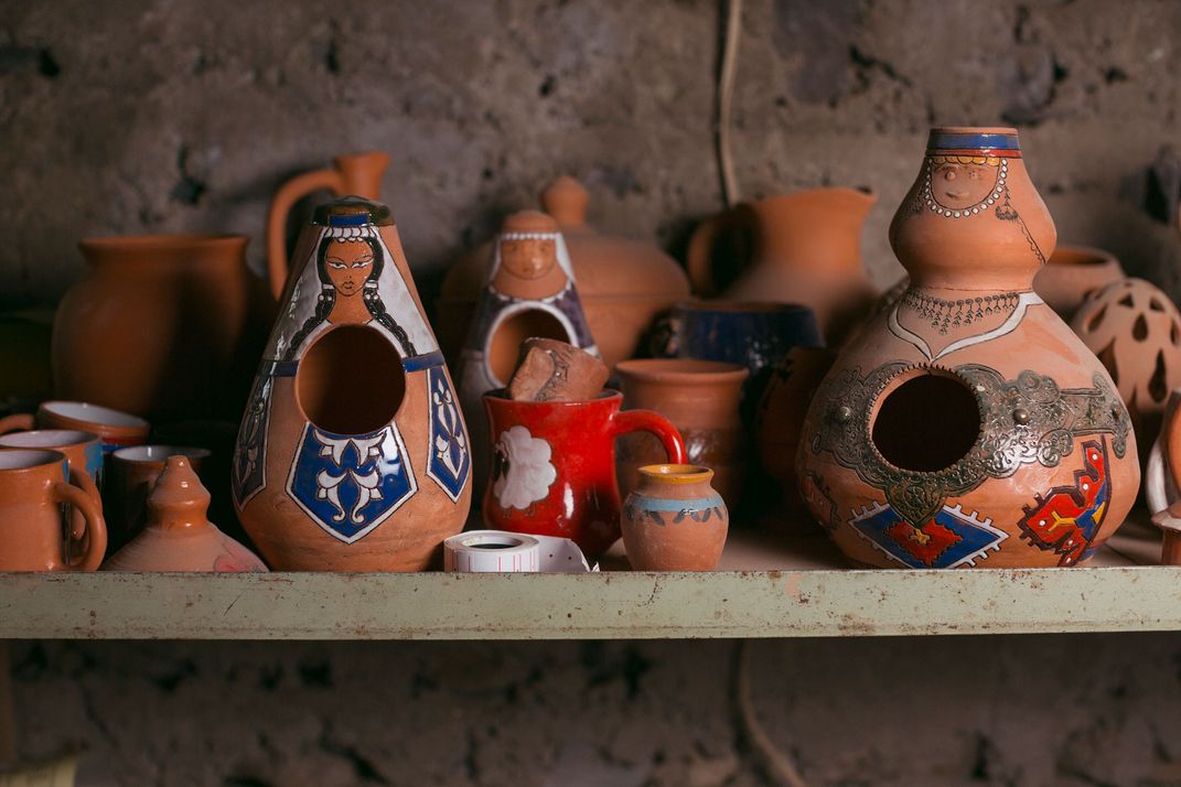  A selection of a few terracotta jars are glazed to appear as if wearing traditional Armenian dress.