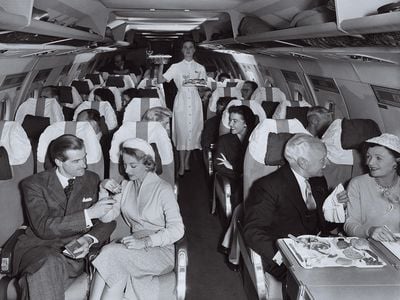 passengers onboard a plane in the 1950s