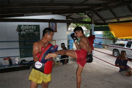 Bahb trains in the ring at Saktaywan Boxing Gym with the head trainer, Ajarn Sit (Ajarn means "teacher").