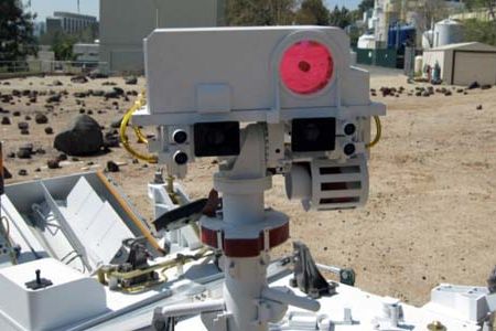 The Mastcam camera on the Mars Science Laboratory rover (shown here exercising in a rock yard at the Jet Propulsion Laboratory) has two "eyes" (the black squares) for binocular vision.