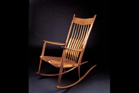 The sensuous curves and subtle walnut grain of Maloof's rocker just seem to beckon and say “Come on in a sit a while.”