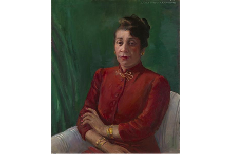 Distinguished in a high-collared, red shirt and gold jewelry, Alma Thomas wears her hair up and looks directly at the viewer. Her arms are crossed loosely, and she sits before a green background.