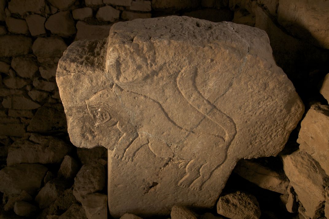 'a stone with a drawing on it'