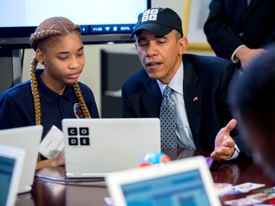 U.S. President Barack Obama participates in an "Hour of Code" event with middle-school students including Adrianna Mitchell in the Eisenhower Executive Office Building next to the White House in Washington, D.C.