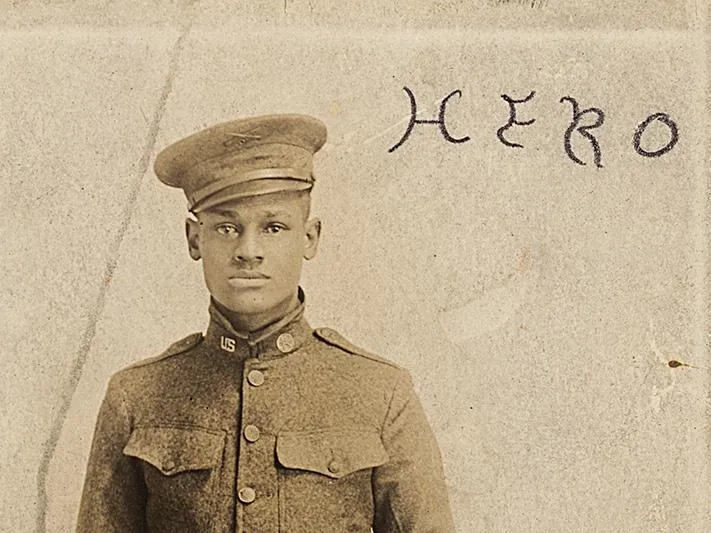 Cpl. Lawrence McVey poses at attention in a photographic postcard.