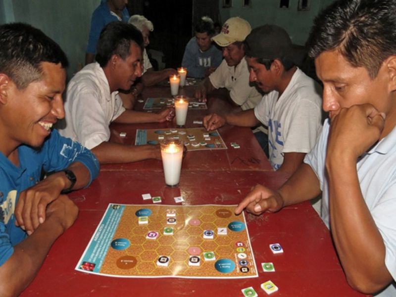 Coffee Farmers Playing Board Game