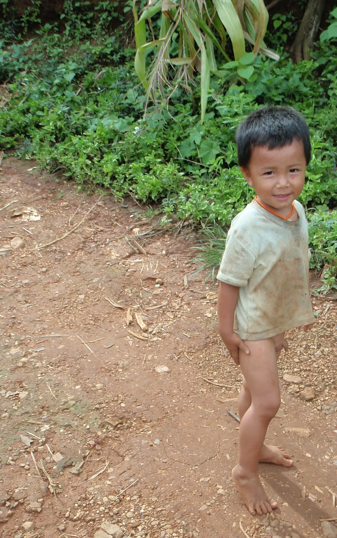 Little boy without pants in Thailand Smithsonian Photo Conte