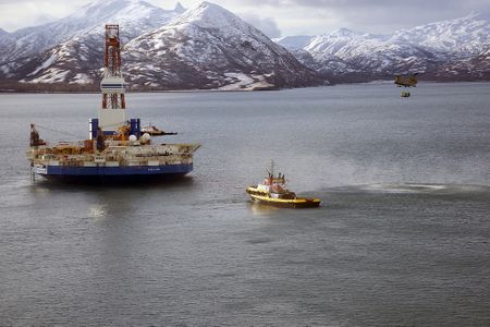 A Chinook helicopter caries supplies to the stranded Kulluk oil drilling platform in January.