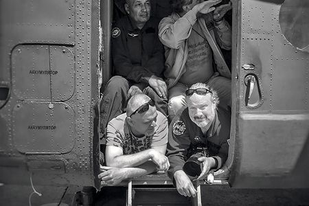 Bill Ingalls (bottom right) in a helicopter prior to taking off for an air-to-air shoot. His first gig was an internship at NASA as a writer and producer, doing TV work.