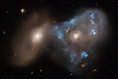 Head-on collisions between galaxies like the one seen in Arp 143 (pictured) may be how rings of new stars form.
&nbsp;