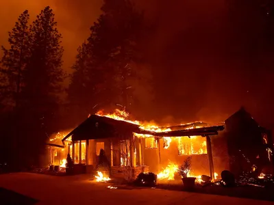 A home burns as the Camp Fire moves through the area on November 8, 2018 in Paradise, California.