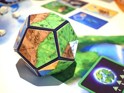 Participants use magnetic landscape tiles to build a perfect planet